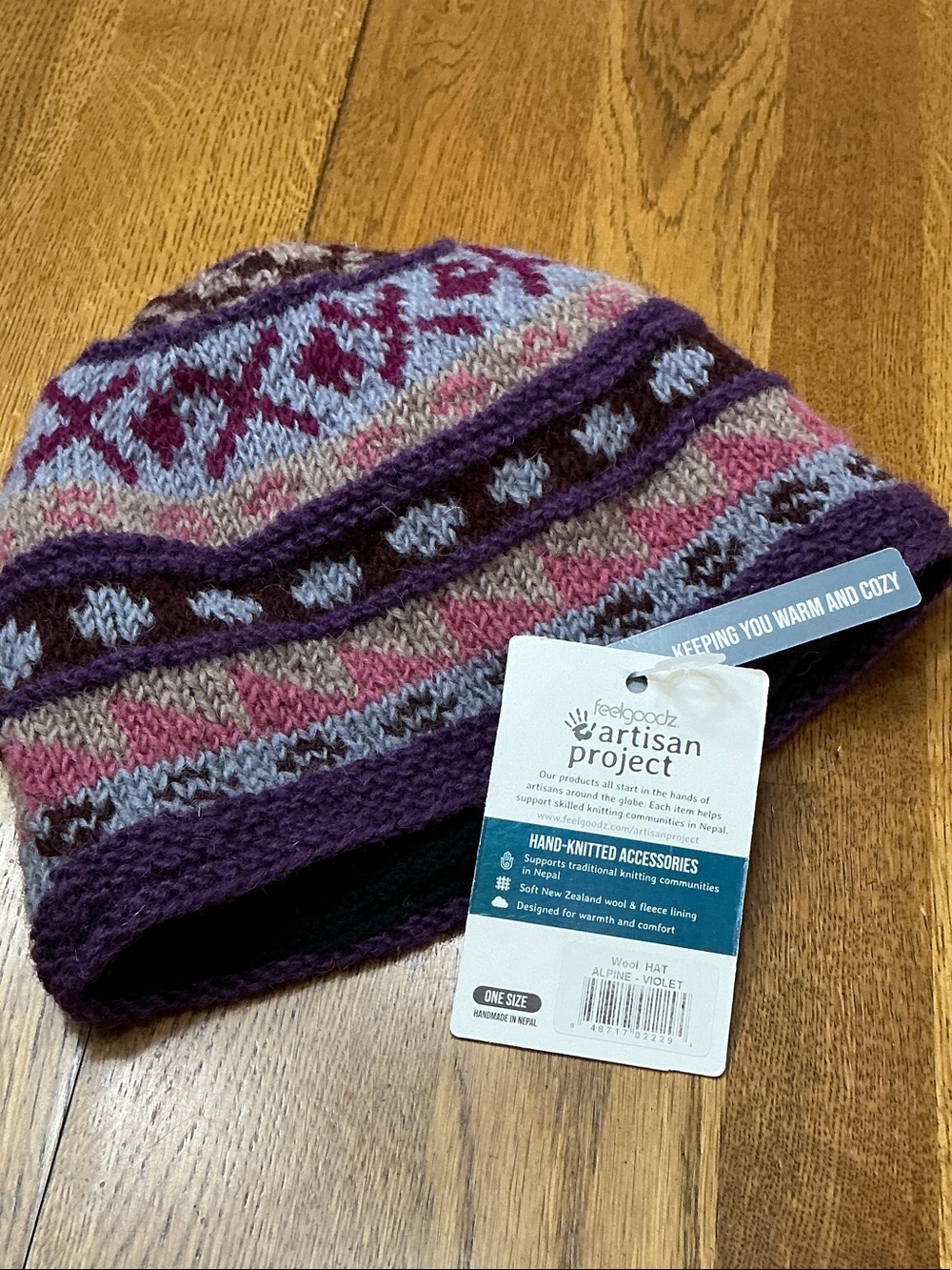 Woman’s Feelgoodz Alpine Violet knit hat. One size. Fully lined. NWT! Never worn